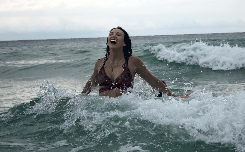 woman in the water smiling 