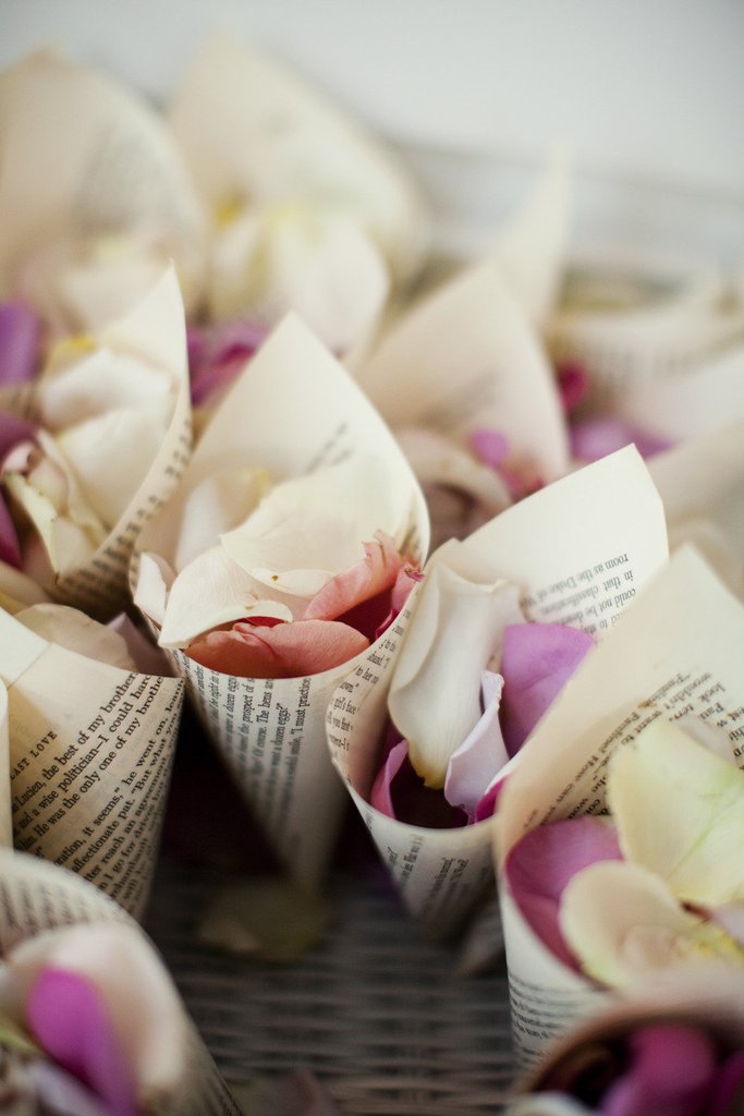 flowers at a cone shaped paper - wedding cones