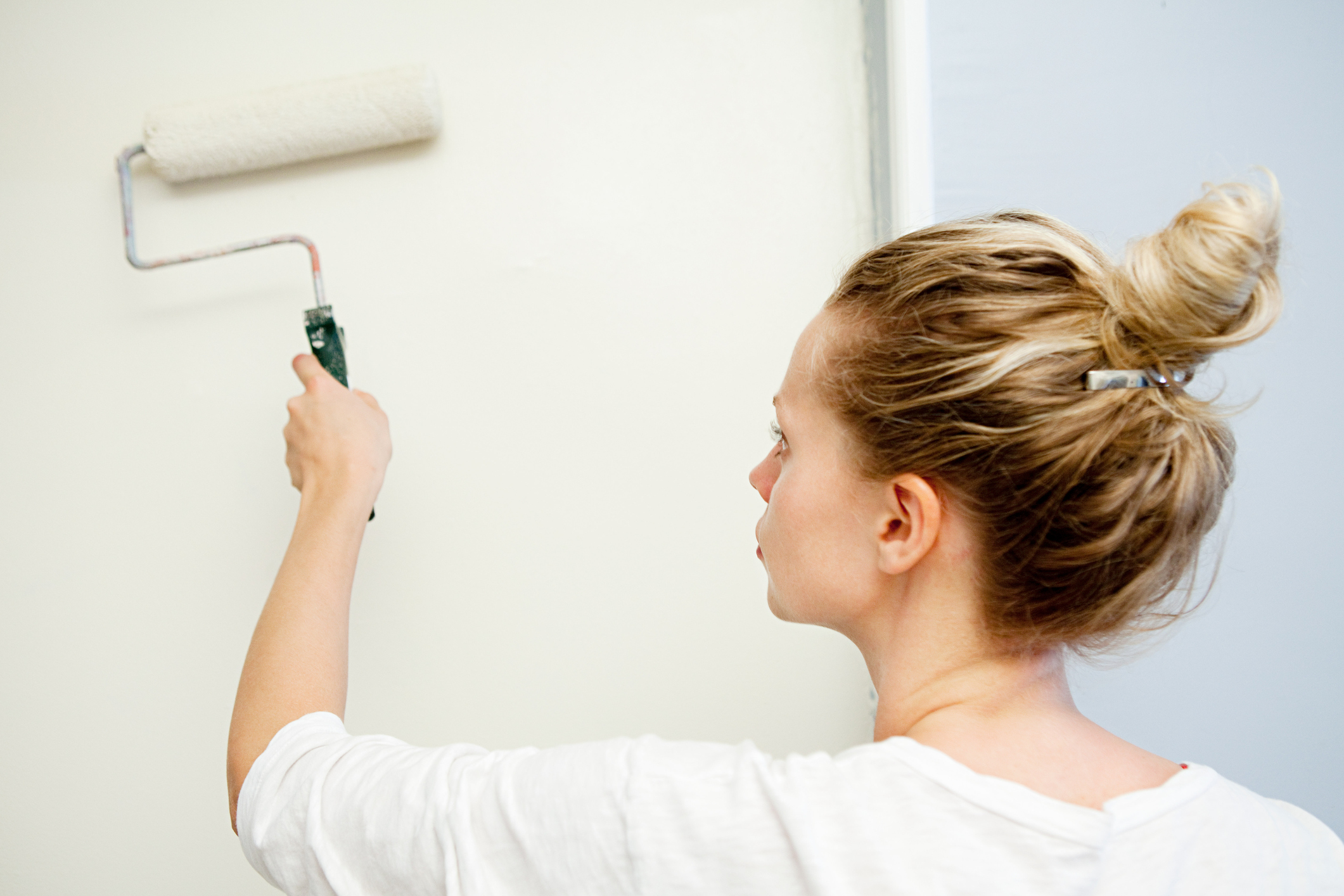 woman painting a wall 