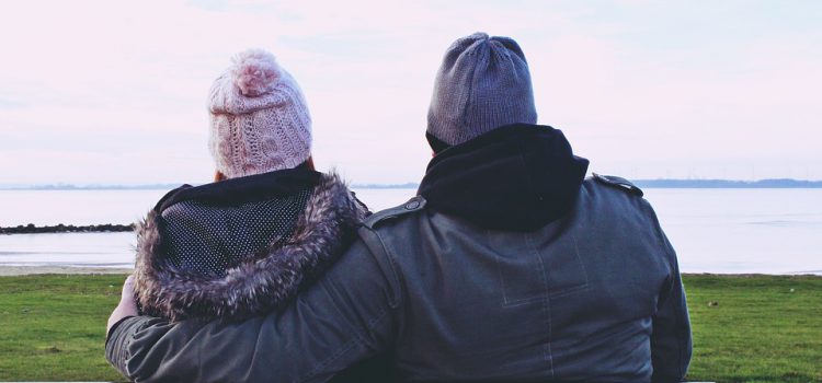 Couple sitting in a Bench