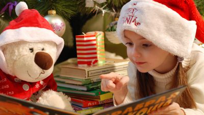 little girl with beart plush toy